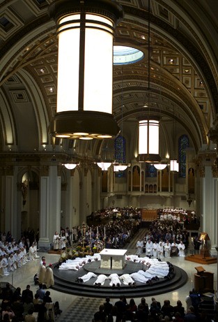 Islander Frank DiGirolamo lies on the altar at St. James Cathedral in Seattle