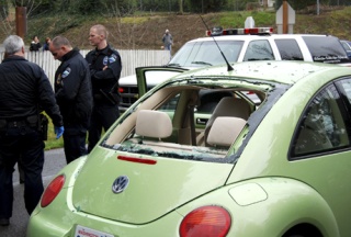 Mercer Island police gather behind the Volkswagen Bug