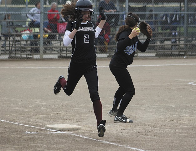 Islander Lilly Blakey tries unsuccessfully to reach first base during the Islanders first district game on Wednesday
