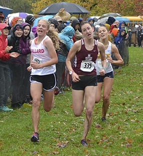Mercer Island’s Chloe Michaels (335) fights off Ballard’s  Veronica Redpath (left) during the 3A Sea-King district cross country meet Oct. 31 at Lake Sammamish State Park. Michaels placed 15th to advance to the 3A state meet.