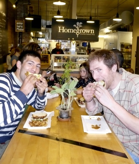 Brad Gillis and Ben Friedman sink their teeth into Homegrown sandwiches at their Fremont shop.