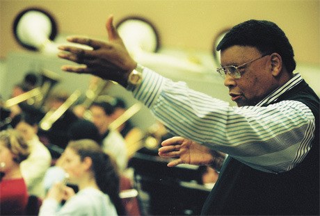 Educator and musician Gene Ferguson conducts band class at Islander Middle School in 2002.