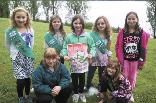 Girl Scout Troop 42651 donated 10 percent of their cookie earnings this spring to the Mercer Island Food Pantry. Elena Briggs