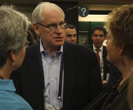 State Sen. Fred Jarrett talks to riders during the opening of the Light Rail on July 18 in Seattle.