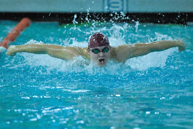 Islander Kyle Moline competes in the 100-yard butterfly final during the SeaKing 3A District swim meet at Mary Wayte Pool on Mercer Island on Saturday.
