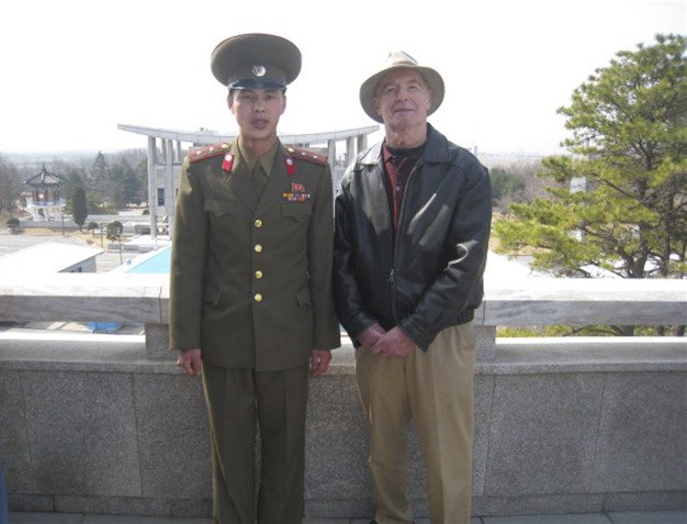 Bob Lewis poses with a North Korean soldier at the southern border