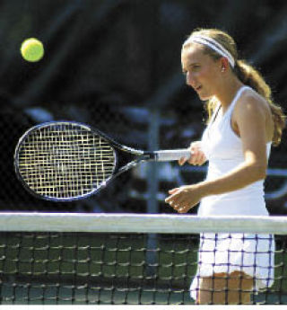 Kelly Crandall heads to the net during the 3A girls tennis tournament in Vancouver