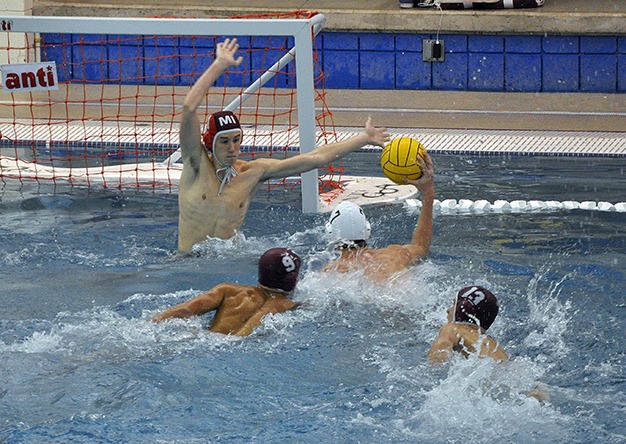 Mercer Island goalie Hunter Peshkin warms up against his fellow teammates during the boys water polo state tournament