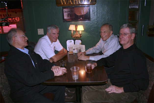 Four Vietnam veterans visit at the Roanoke Inn Veterans Day celebration. Two of them had never met before