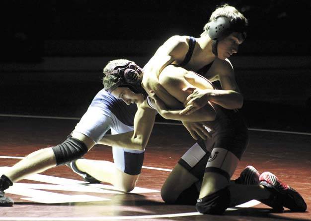 Jake Pruncho tries to find a way to bring down Interlake's Nathan Jochum