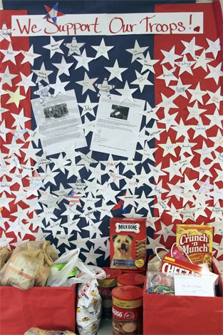 Donations from West Mercer students and families fill the school’s main hallway for ‘Mail Call For Our Heroes.’