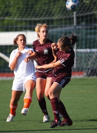 Grace Braunstein (above) redirects play with a header against Auburn Synergy. The Mercer Island Momentum U16 team defeated them