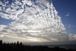 Clouds paint a swath across the afternoon sky over Mercer Island on Thursday
