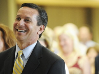 Republican gubernatorial candidate Dino Rossi laughs during the opening welcome at the Mercer Island Rotary lunch at the Community Center at Mercer View on Mercer Island Tuesday
