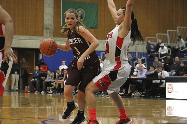 Mercer Island's Jamie Mounger tries to drive past Cleveland's Myla Hightower Thursday