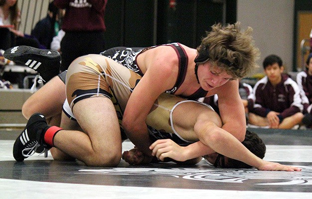 Mercer Island’s Donnie Howard (top) finished first in the 182 bracket at the 3A KingCo tournament Saturday