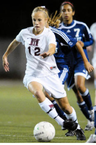 Islander midfielder Rachel Pedreira advances a ball against Interlake at Mercer Island last Tuesday.