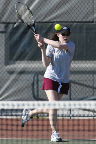 Islander Michelle Zemplenyi returns a volley against Bellevue High School on April 23 as Mercer Island sweeps the Wolverines 9-0 to officially earn the regular season 3A KingCo title. The Islanders are undefeated this season and have not lost more than one match during any meet this year. Zemplenyi was 2-0 in singles play and 3-0 in doubles action last week.