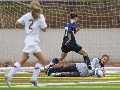 Islander goalie Corey Goelz (1) stops a ball during a playoff game against Glacier Peak at Mercer Island on Saturday. The Islanders won 2-1. See a recap story on page 9 in this week’s Reporter.