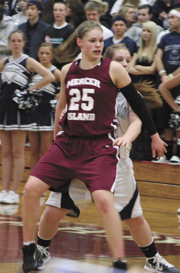 Mercer Island’s Christina Williamson blocks a Glacier Peak player from the key during the Islanders’ loss to the Grizzlies last Friday in the first round of the state tournament.