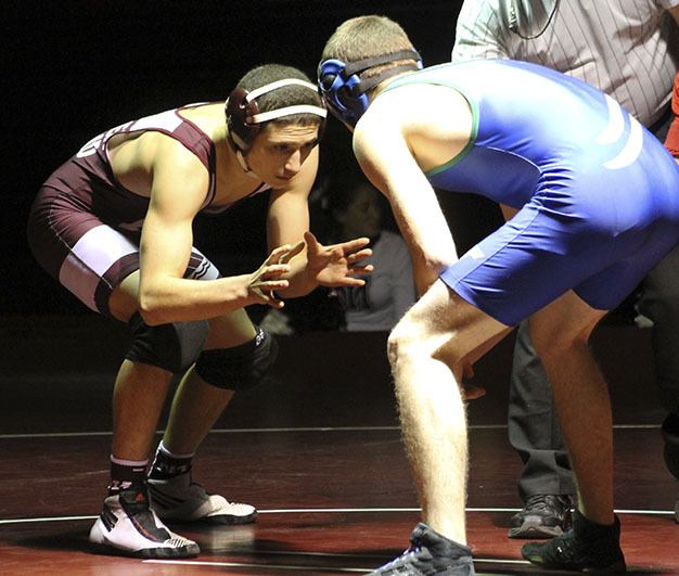 Mercer Island’s Jake Pruchno prepares to grapple with Liberty’s Zach Toombs Thursday