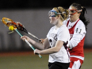 Islander Margaret Greutert is stripped of the ball during a game against Snohomish at Mercer Island on April 15.