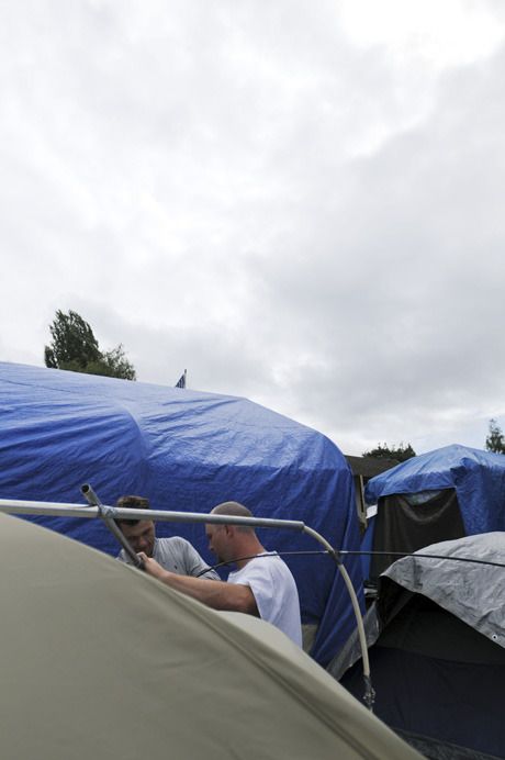 Members of Tent City 4 set up camp at the United Methodist Church in August 2008.