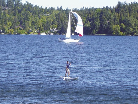 A stand-up paddle boarder spends time on the water on Sunday