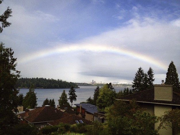 A rainbow appears over Mercer Island on the first day of autumn