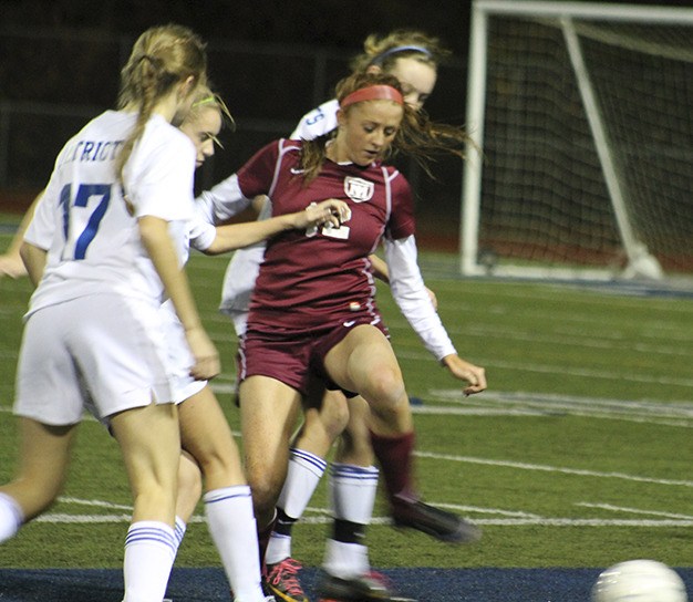 Senior captain Michele Day fights for possession against Liberty High School Thursday