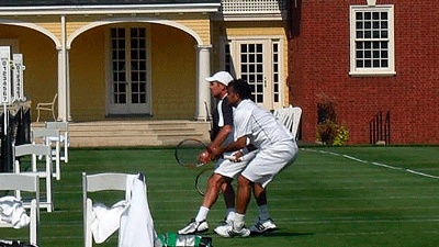 Mercer Island Country Club doubles tennis pair Kelly Evernden and Vivek Varma play earlier this summer during a USTA-sanctioned tournament at the Germantown Cricket Club in Philadelphia.