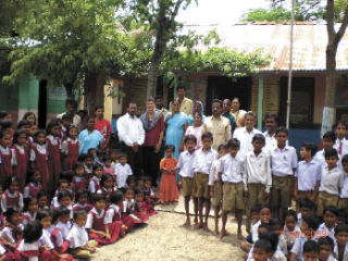 Vicky Mann visits with teachers and students at a school in Tandali