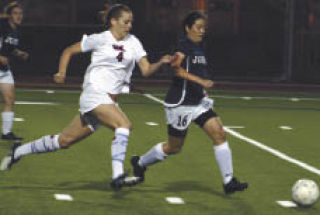 Islander forward Ellen Haas sprints to get to the ball during Mercer Island’s home win against Juanita last Tuesday night. The final score was 3-1.