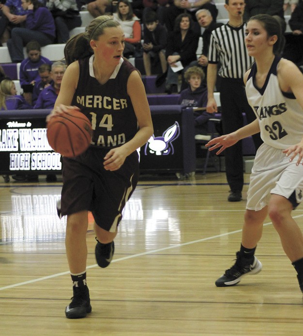 Mercer Island's Jessica Blakeslee looks for a way around Lake Washington's Madison Shepard during the Islander girls win over the Kangs on Thursday