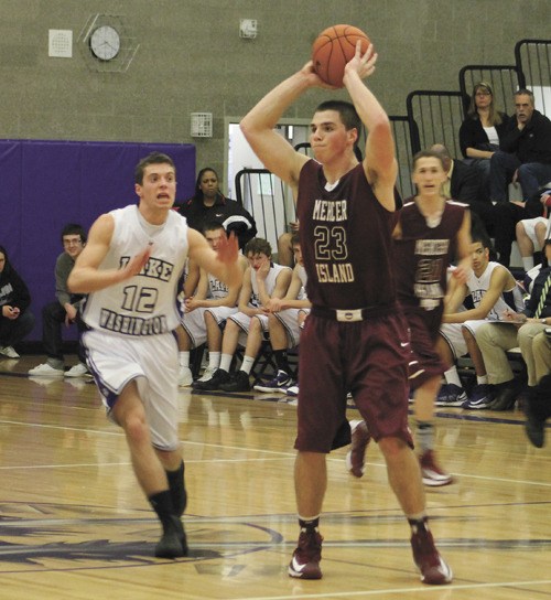 Espen Platou (23) passes during the Islanders win over Lake Washington on Thursday