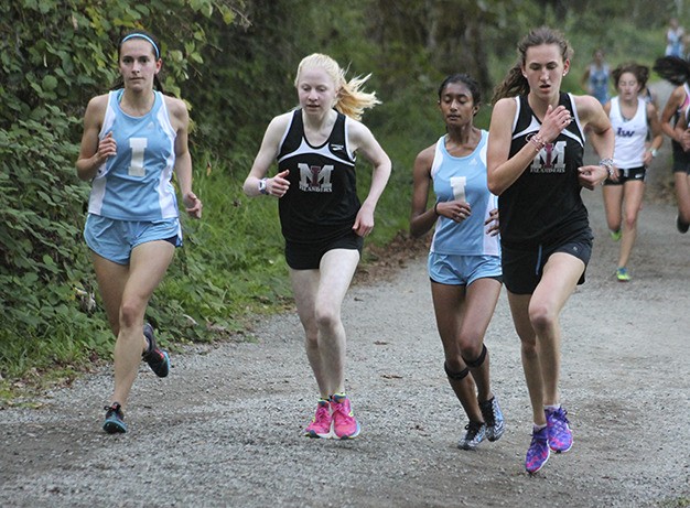 Mercer Island's Cece Rosenman (second from left) and Chloe Michaels (far right) keep pace with Interlake's Camila David-Smith (far left) and Aishanee Wijeratna Wednesday