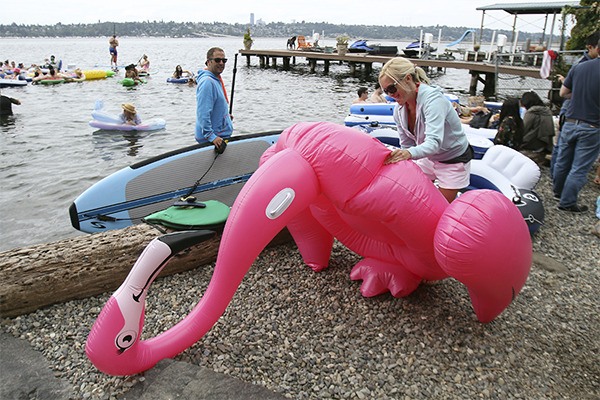 Greta Pokorny of Mercer Island deflates her floating pink flamingo