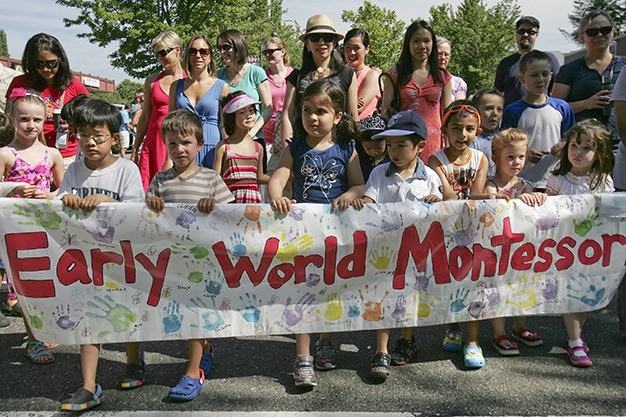 The students of Mercer Island’s Early World Montessori School take carrying their custom-made sign very seriously as they march in the Summer Celebration! Grand Parade on Saturday morning