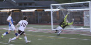 Islander Nick Ward takes a shot against Liberty.