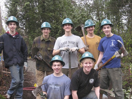 Local volunteers and members of Boy Scout Troop 457 gave their time to help clean a patch of the Mountains to Sound Greenway on Mercer Island. Back row: Max Foster