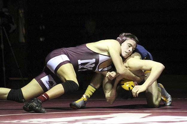 Mercer Island's Trevor Gullstad takes down Bellevue's Garrett Williams Thursday