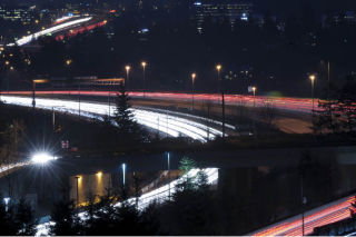 Headlights paint red and white streaks across the East Channel Bridge of Interstate 90 on Mercer Island