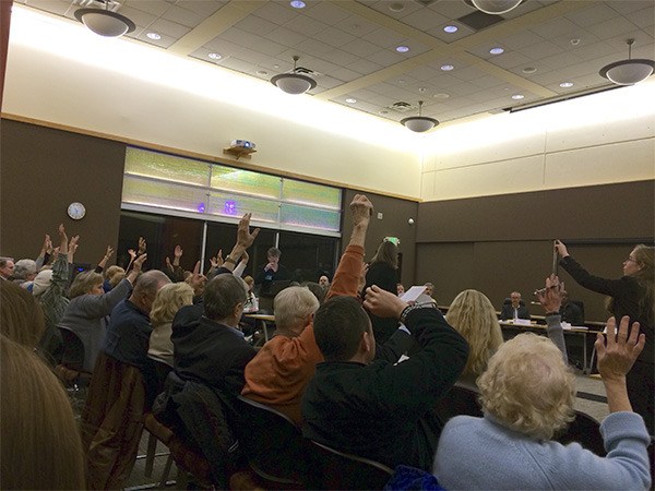 About 37 Islanders raised their hands at the KCLS Board of Trustees meeting on Nov. 20 to show their support for pausing the Island library remodel.