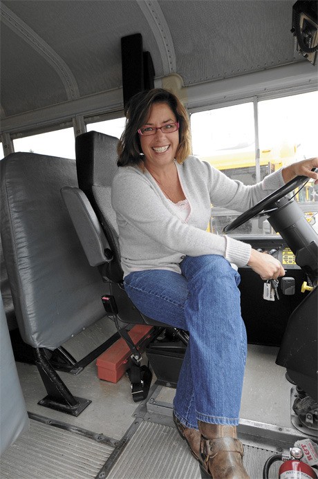 Islander Megan Hand is shown at the wheel of a school bus as part of a portfolio of women who are featured in an on-line photo album produced by celebrity photographer Annie Leibovitz.