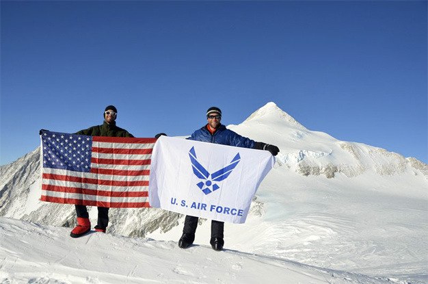 Rob Marshall and Graydon Muller hoist the United States and USAF flags at the Summit of Mt. Vinson in Antarctica last month. The two men are part of the Air Force Seven Summits Challenge team. The goal is to climb the highest peak on each of the seven continents to honor fallen soldiers through the 'Special Operations Warrior Foundation.'
