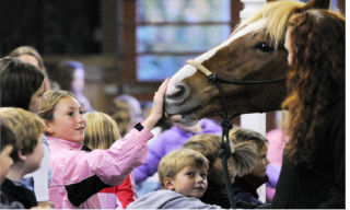 Lakeridge fifth-grader Hadley Michaels greets ‘Winston