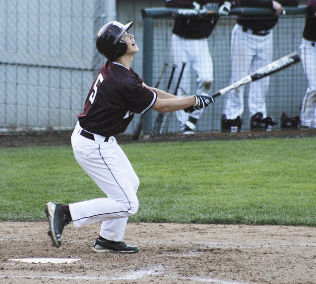 Chris Lawler (5) watches as his hit flies during the Islanders KingCo loss to Mount Si on Thursday.