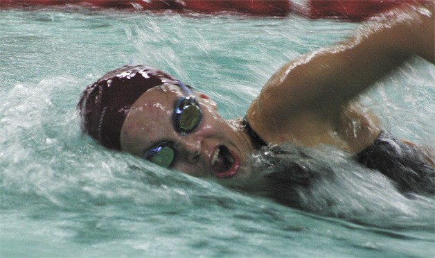 Mercer Island freshman Caitlin Cox swims her first lap of the 200 freestyle race at the SeaKing district meet last Saturday. The Islanders won and will compete at state this weekend.
