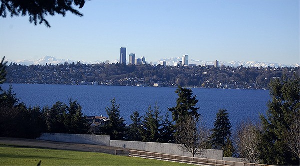 The Olympic Mountains peek out from behind the Seattle skyline in a view from Aubrey Davis Park on Dec. 30.