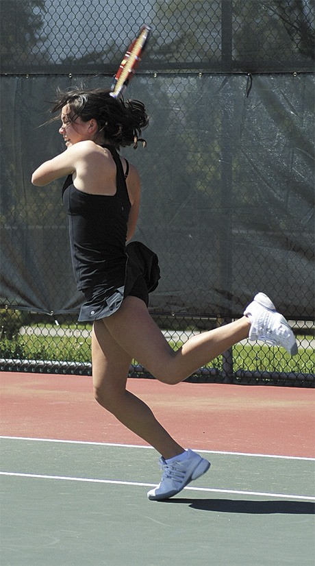 Chelsea Bailey returns a serve during the 3A KingCo girls tennis tournament at Skyline High School last weekend.